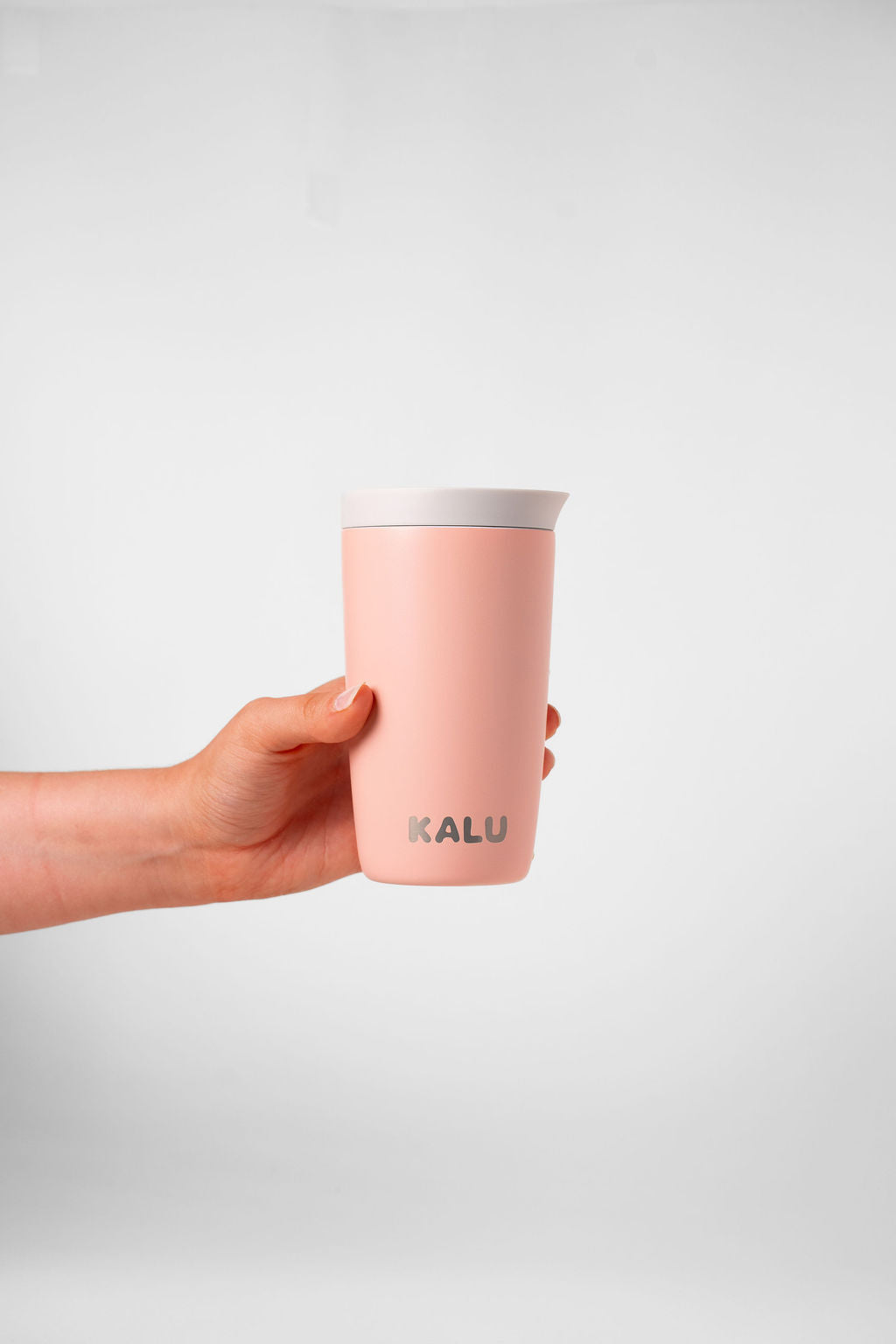 KALU reusable cup Sunrise Coral - hand grip view NZ