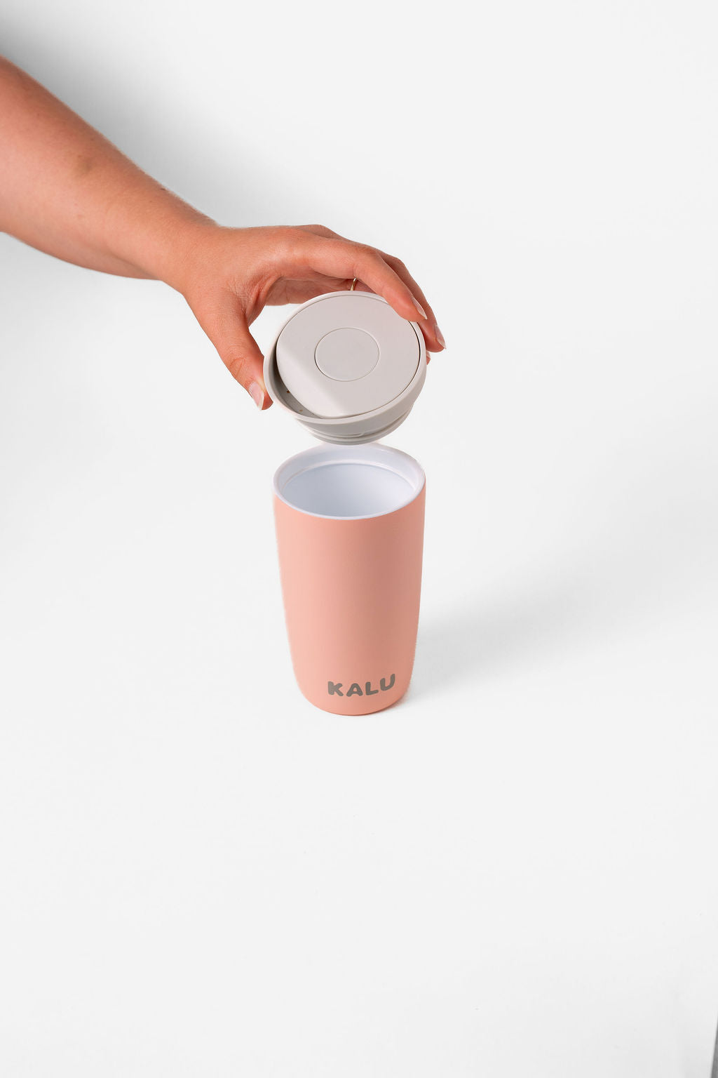 KALU ceramic coffee cup Sunrise Coral - lid removed showing ceramic interior